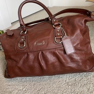 Women’s brown leather coach handbag
